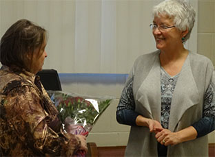 Sheila presents Karis with a boquet of roses